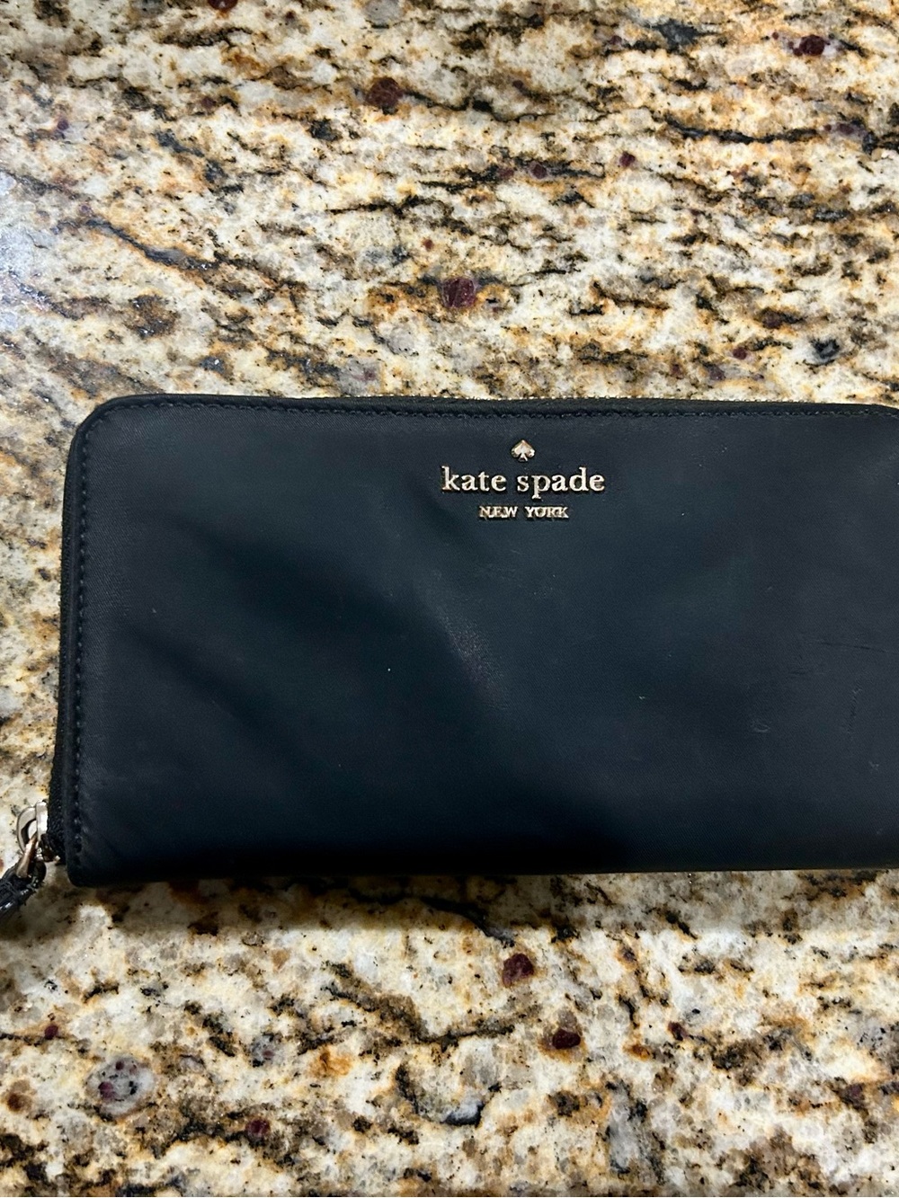 kate spade black continental zip-around wallet with gold logo
